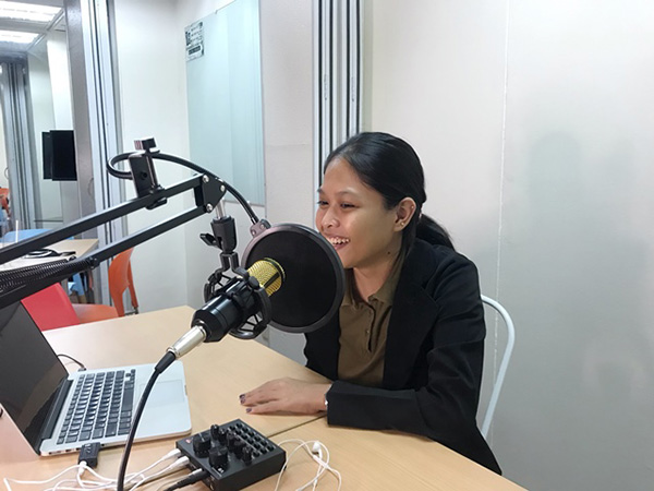 woman laptop podcast